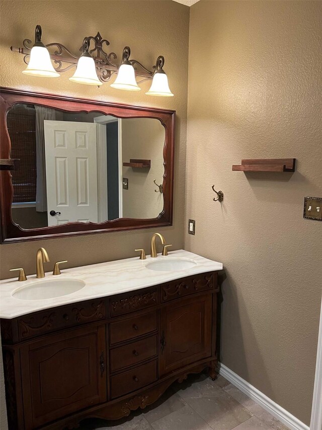 bathroom featuring tile patterned flooring and vanity