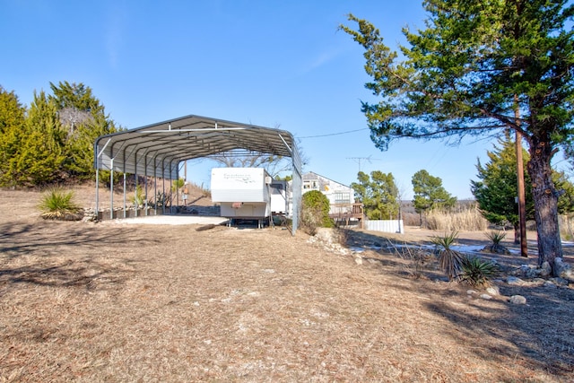 view of parking / parking lot with a carport