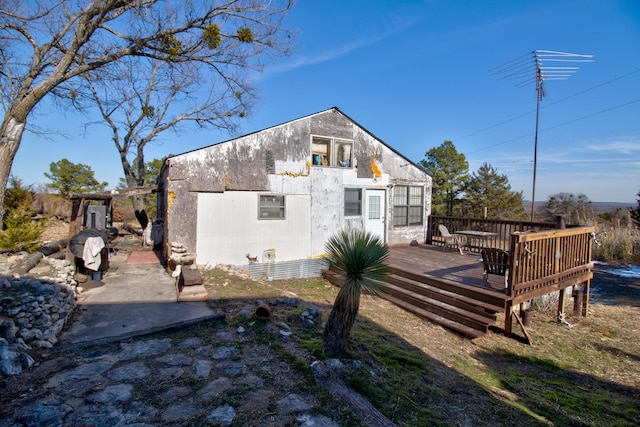 1110 Dye Mound Rd, Forestburg, TX 76239 - rear view of house featuring a wooden deck and outdoor dining space