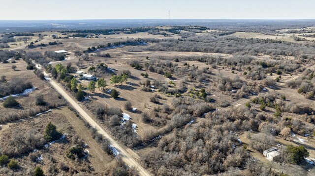 birds eye view of property with a rural view