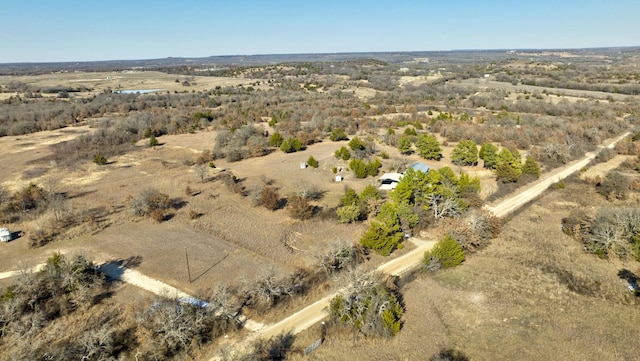 birds eye view of property featuring a rural view