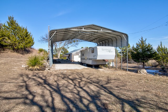 view of vehicle parking with a carport