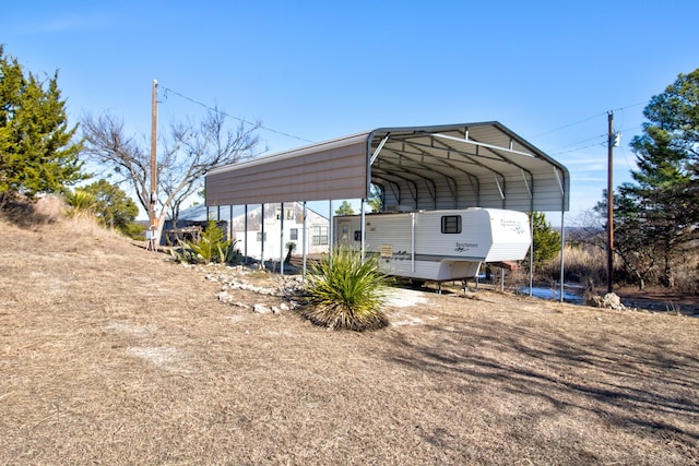 1110 Dye Mound Rd, Forestburg, TX 76239 - view of vehicle parking with a detached carport and driveway