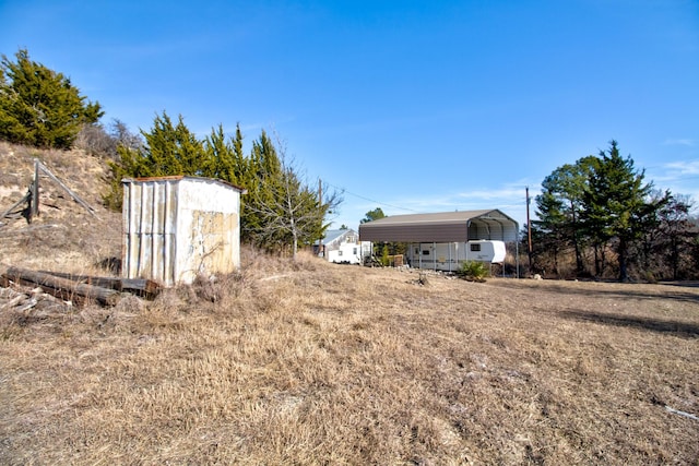 1110 Dye Mound Rd, Forestburg, TX 76239 - view of yard featuring a carport and a storage shed