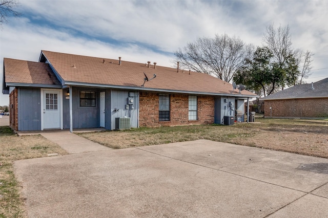 back of property with a patio area and central AC unit