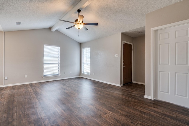 empty room featuring ceiling fan, dark hardwood / wood-style flooring, lofted ceiling with beams, and a textured ceiling