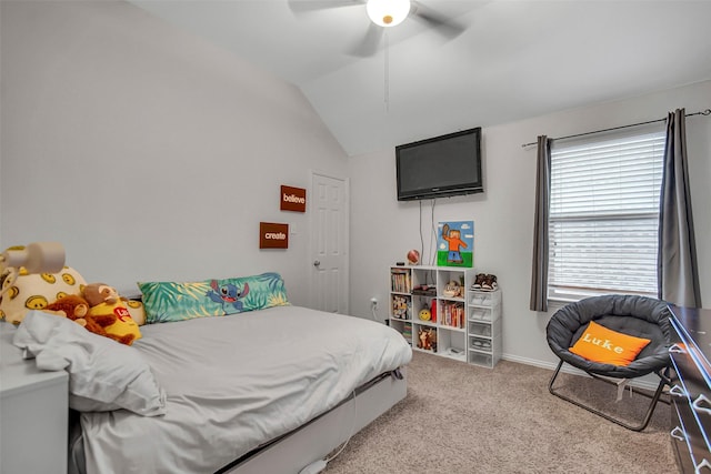 bedroom with vaulted ceiling, light colored carpet, and ceiling fan