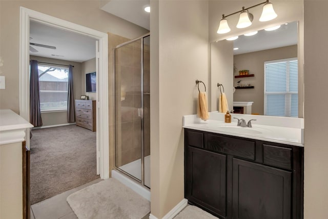 bathroom featuring vanity and an enclosed shower