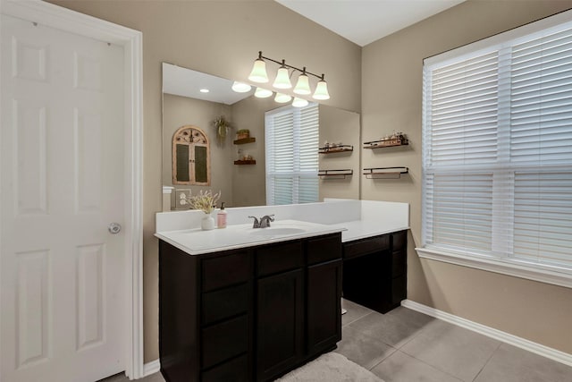 bathroom featuring tile patterned flooring and vanity