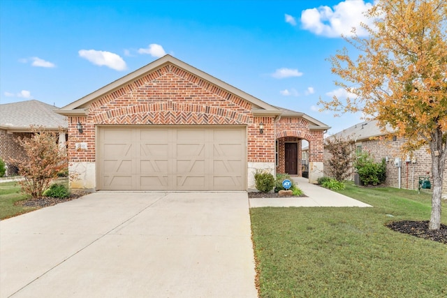 view of front of property with a front yard and a garage