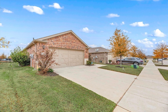 view of front of house featuring a front yard and a garage