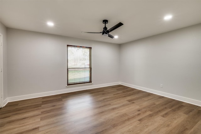 empty room featuring ceiling fan and wood-type flooring