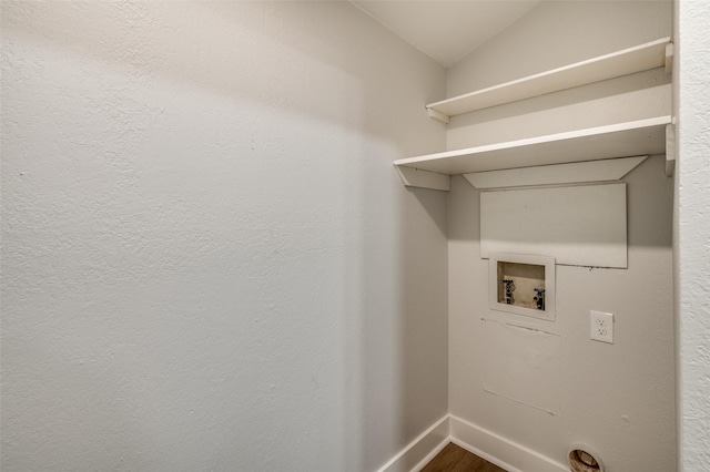 washroom with hookup for a washing machine and wood-type flooring