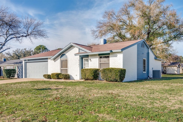 ranch-style house with cooling unit, a front lawn, and a garage