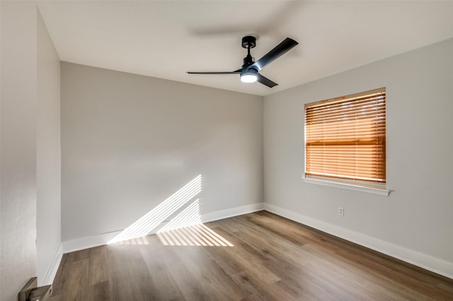 unfurnished room with ceiling fan and hardwood / wood-style flooring