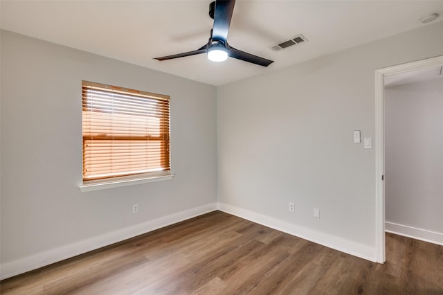 empty room featuring ceiling fan and hardwood / wood-style flooring