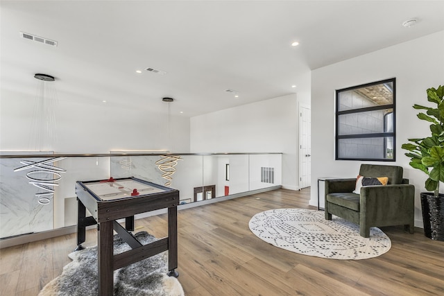 recreation room featuring visible vents, wood finished floors, and recessed lighting