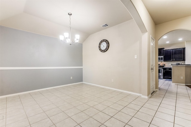 unfurnished dining area with light tile patterned flooring, a chandelier, lofted ceiling, and sink