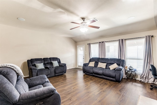 living room with ceiling fan, dark hardwood / wood-style flooring, and vaulted ceiling