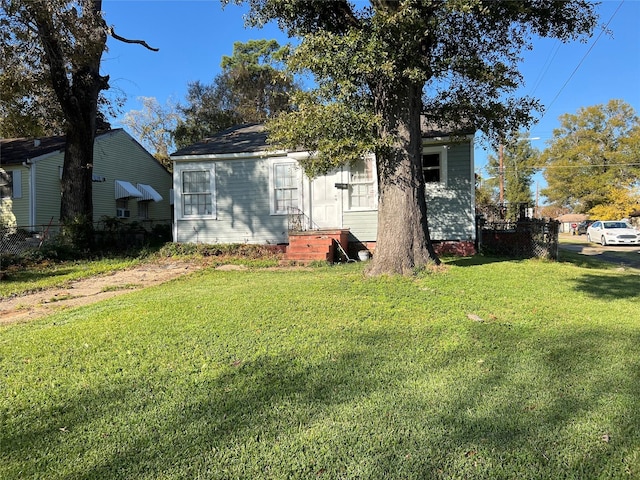 view of front of home with a front yard