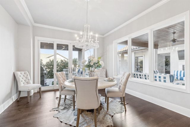 dining space featuring ceiling fan with notable chandelier, ornamental molding, plenty of natural light, and dark hardwood / wood-style floors