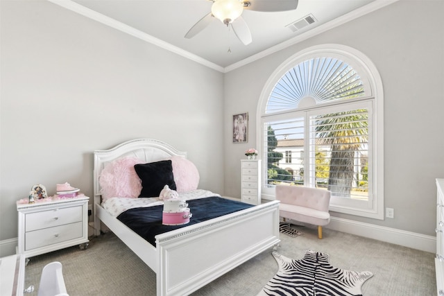 carpeted bedroom with ornamental molding and ceiling fan