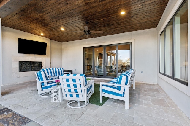 view of patio with french doors and ceiling fan