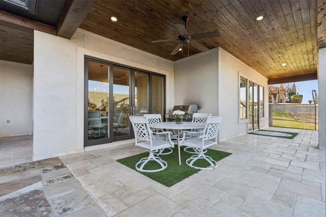 view of patio featuring ceiling fan and a mountain view