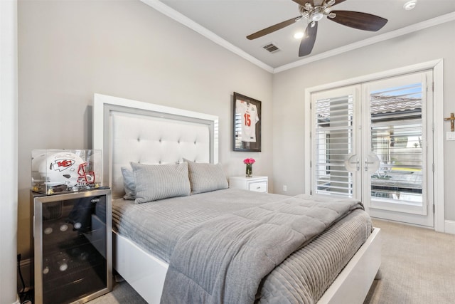 bedroom featuring ceiling fan, light colored carpet, access to outside, and multiple windows