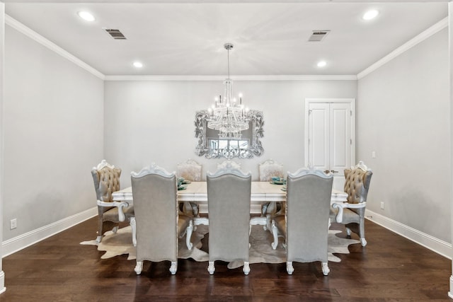 dining room featuring a chandelier, crown molding, and dark wood-type flooring