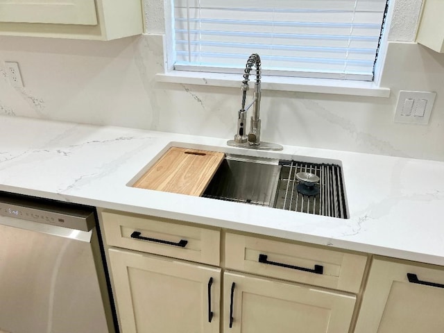 room details with sink, dishwasher, and light stone counters