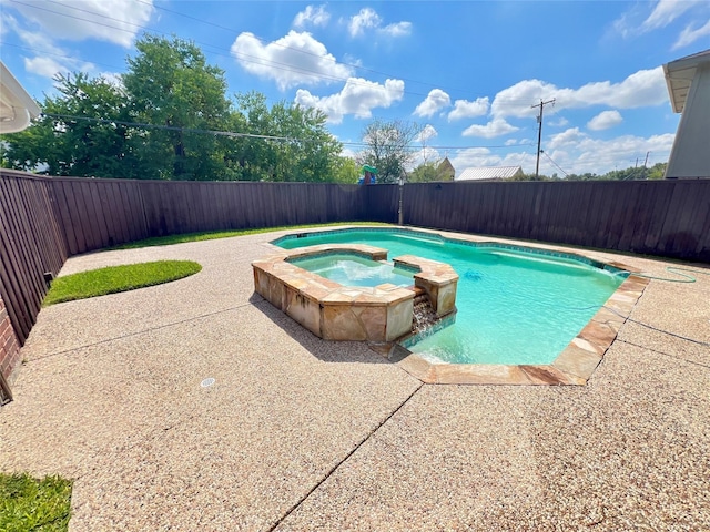 view of swimming pool featuring an in ground hot tub and a patio