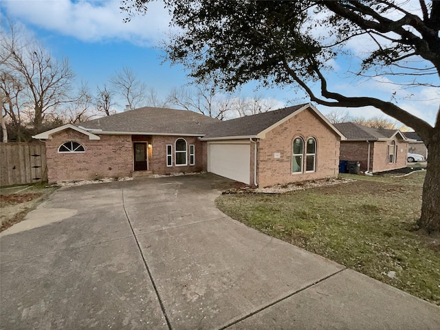 ranch-style house with a front yard and a garage