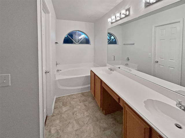 bathroom featuring a tub and vanity