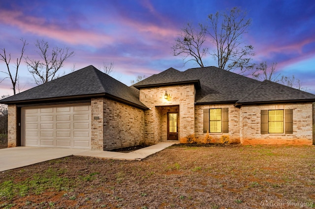 view of front of property with a garage