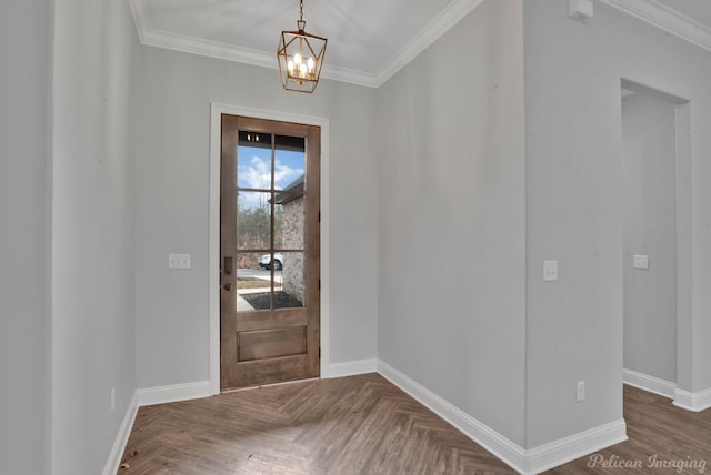 entrance foyer with dark parquet floors, a chandelier, and crown molding