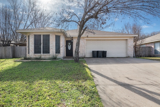 ranch-style house featuring a front yard and a garage