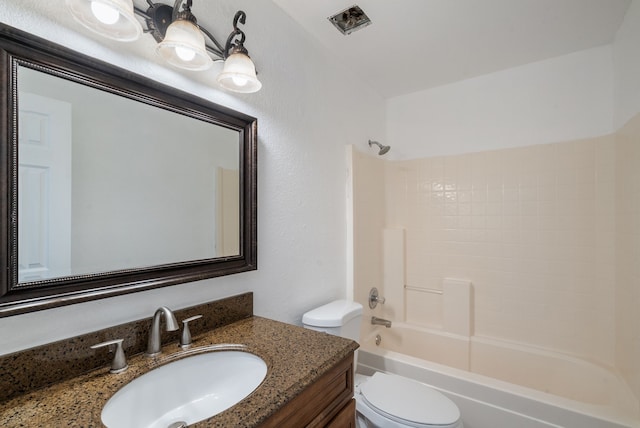 full bathroom with shower / bathtub combination, vanity, and toilet