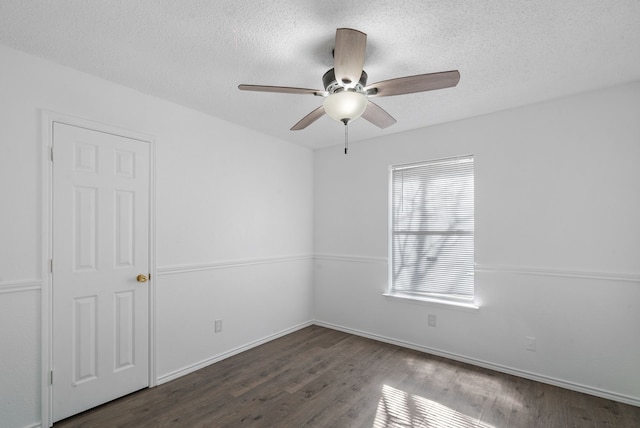 unfurnished room with dark hardwood / wood-style flooring, a textured ceiling, and ceiling fan