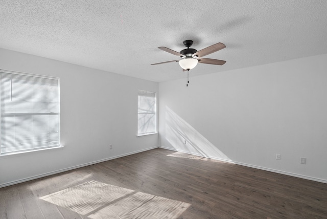 unfurnished room with a textured ceiling, ceiling fan, and dark hardwood / wood-style floors