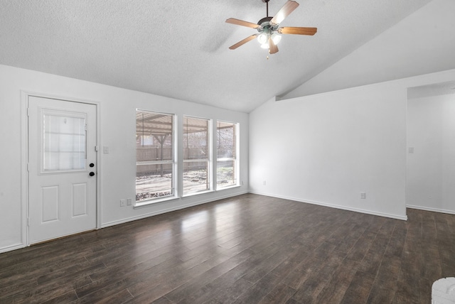 unfurnished living room featuring lofted ceiling, a textured ceiling, ceiling fan, and dark hardwood / wood-style floors