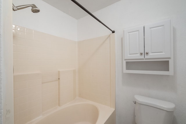 bathroom with toilet and shower / bath combination