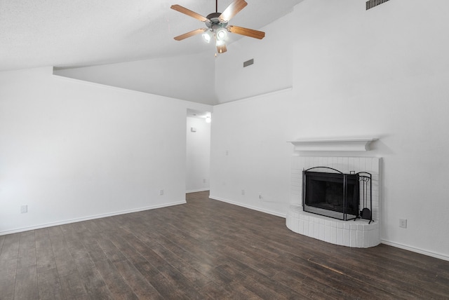 unfurnished living room with a fireplace, dark wood-type flooring, ceiling fan, and vaulted ceiling