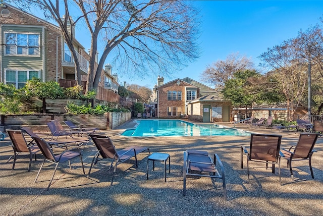 view of swimming pool featuring a patio area