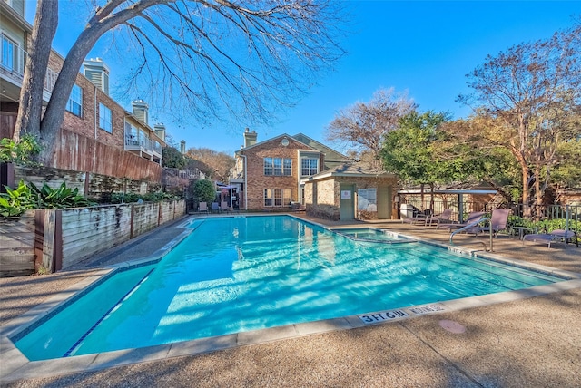 view of pool featuring an outbuilding