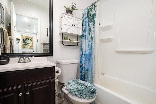 full bathroom featuring shower / tub combo, vanity, and toilet