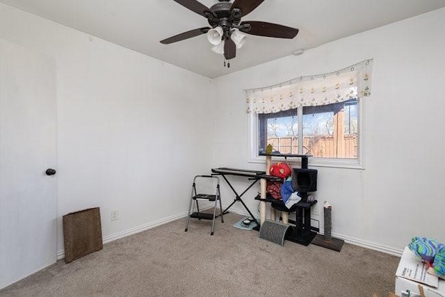 misc room featuring ceiling fan and carpet flooring