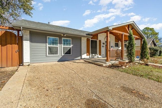 back of house with covered porch