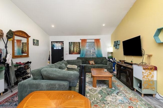 living room with lofted ceiling and light hardwood / wood-style floors