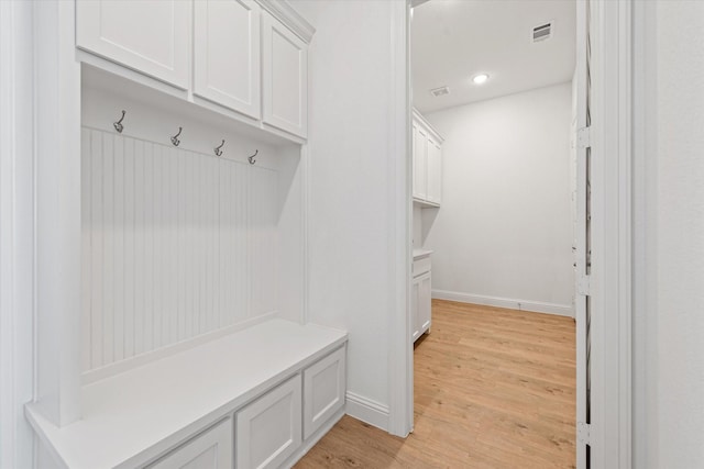 mudroom with light hardwood / wood-style flooring